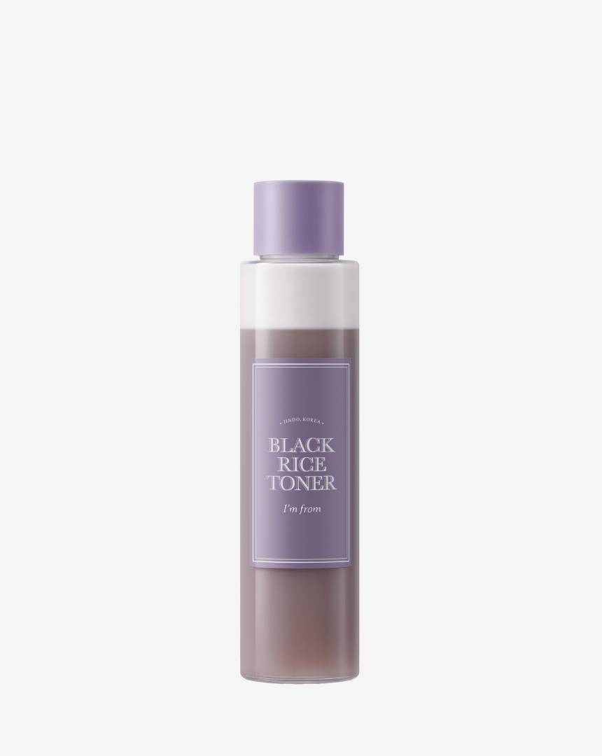 I'M FROM Black Rice Toner in a clear bottle, showing the dark liquid inside, designed for skincare and hydration.