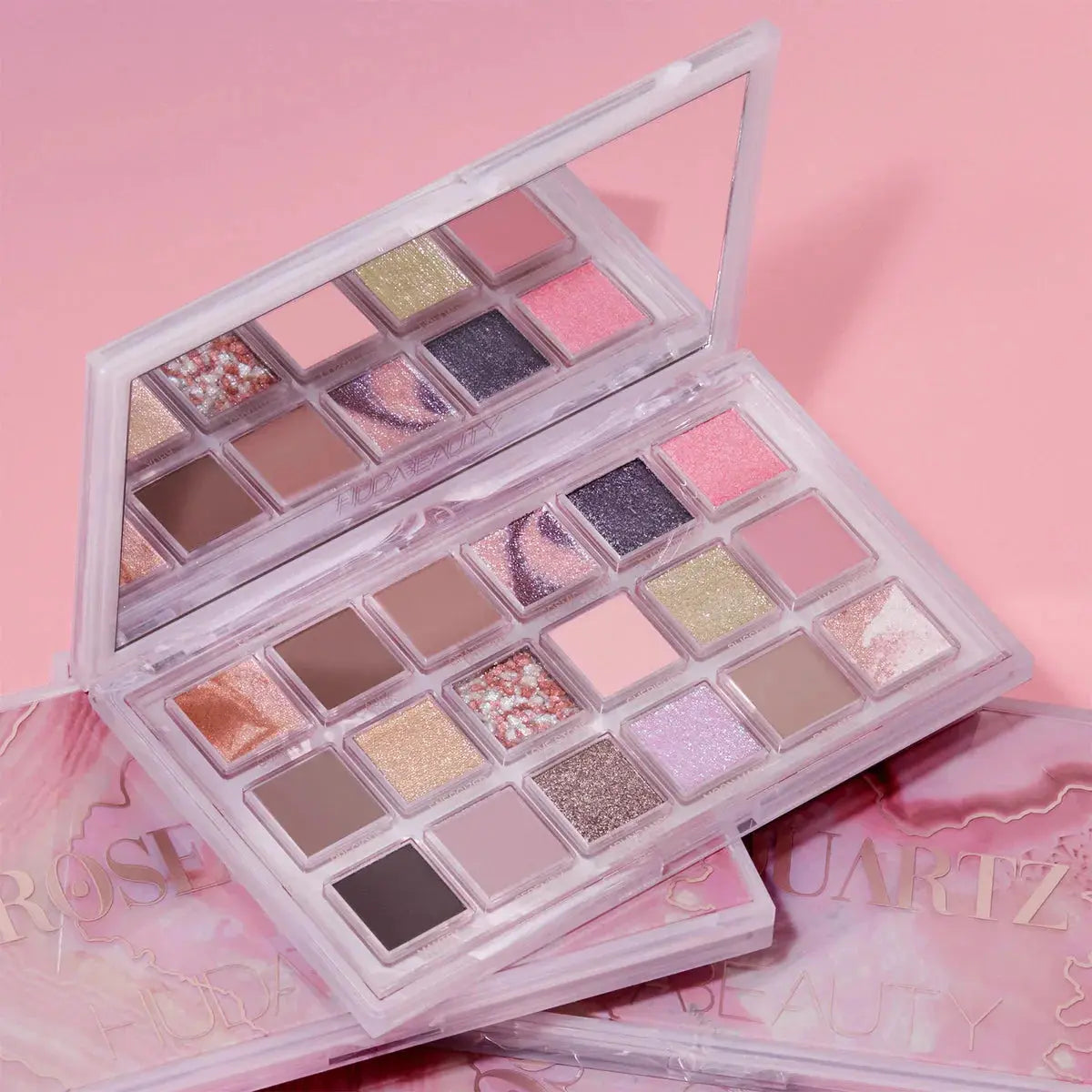 Huda Beauty Rose Quartz Eyeshadow Palette with pink, beige, and shimmer shades in a sleek compact for versatile eye looks.