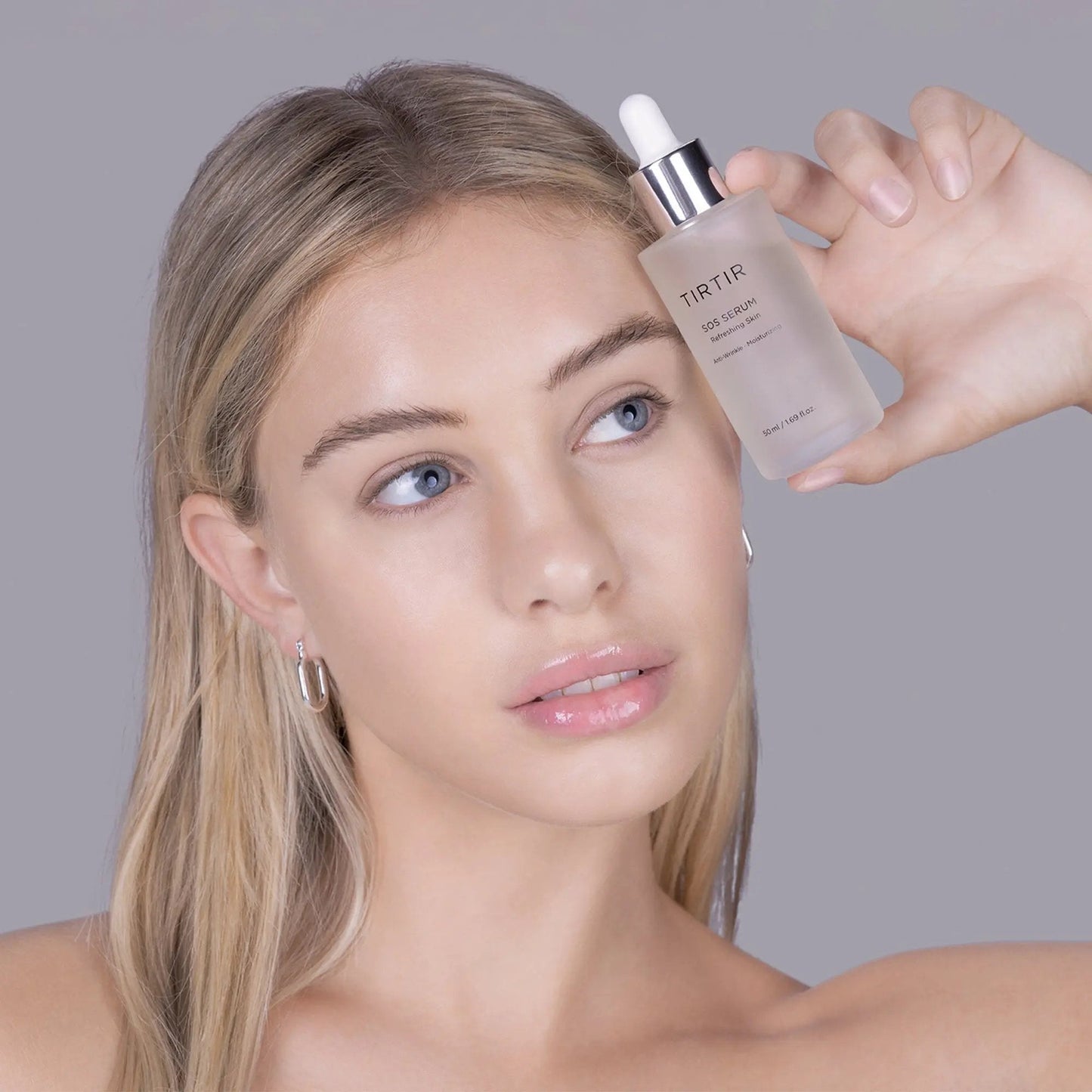 TIRTIR SOS Serum 50ml bottle with dropper, skincare product for soothing and revitalizing skin.