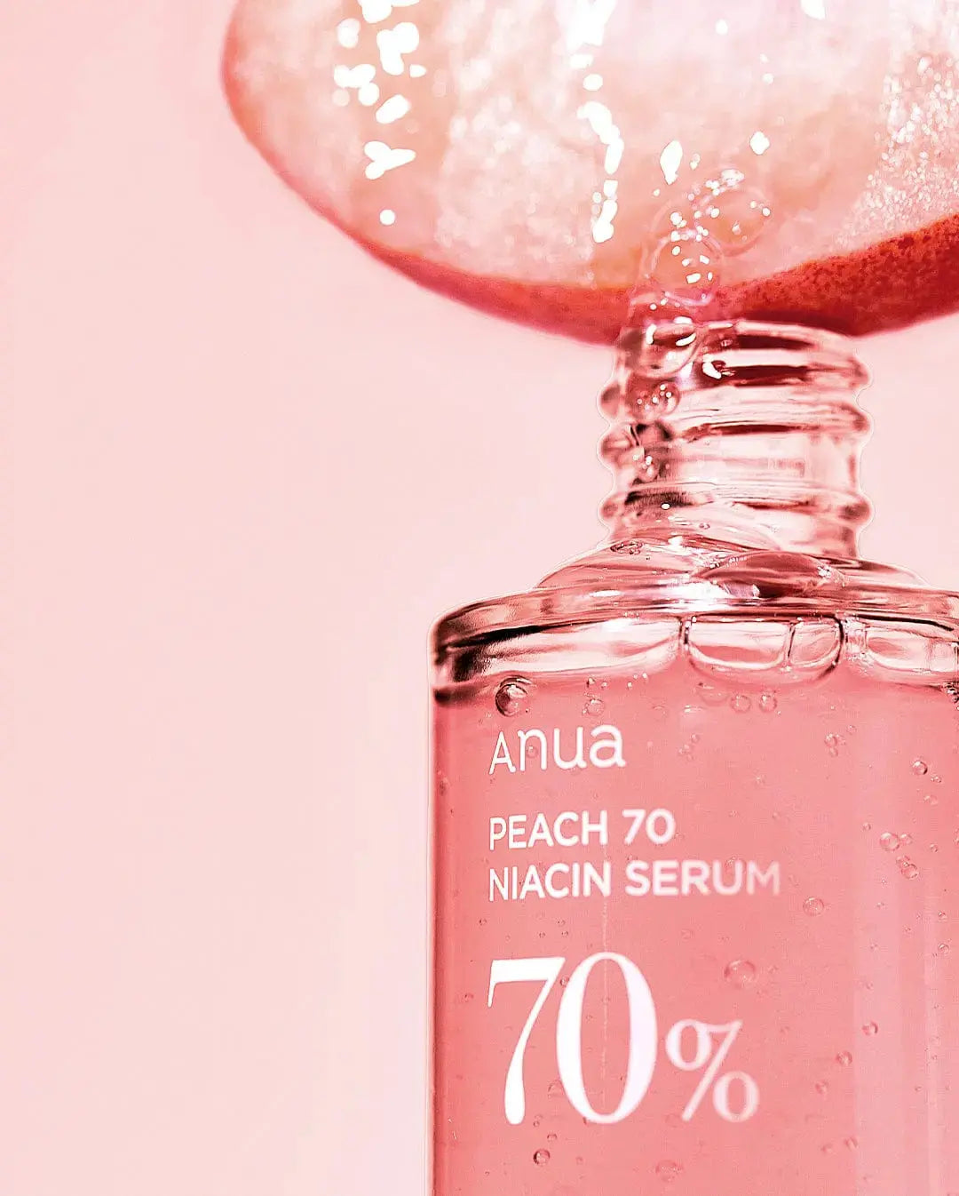 ANUA Peach 70% Niacinamide Serum 30ml bottle with peach-themed packaging, skincare product for brightening and improving skin tone