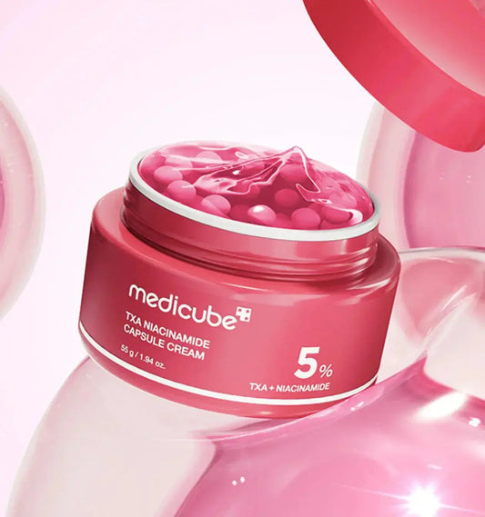 Medicube TXA Niacinamide Capsule Cream in a 55g jar, featuring a smooth, white cream with capsule design for skincare.