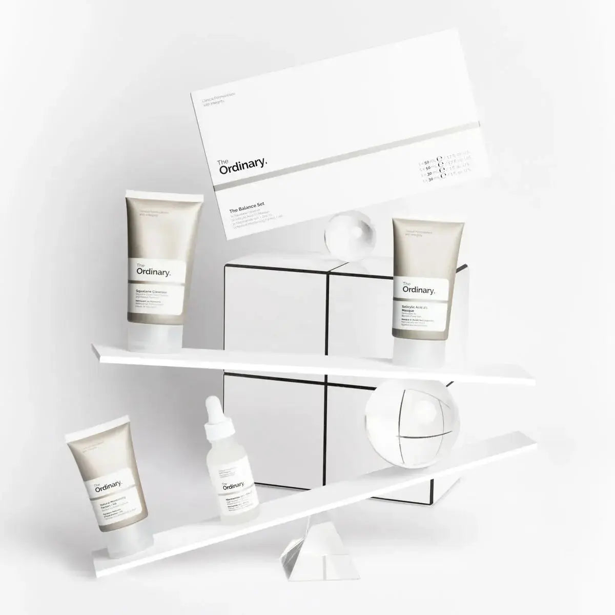 Image of THE ORDINARY The Balance Set featuring skincare products in minimalist packaging on a neutral background.