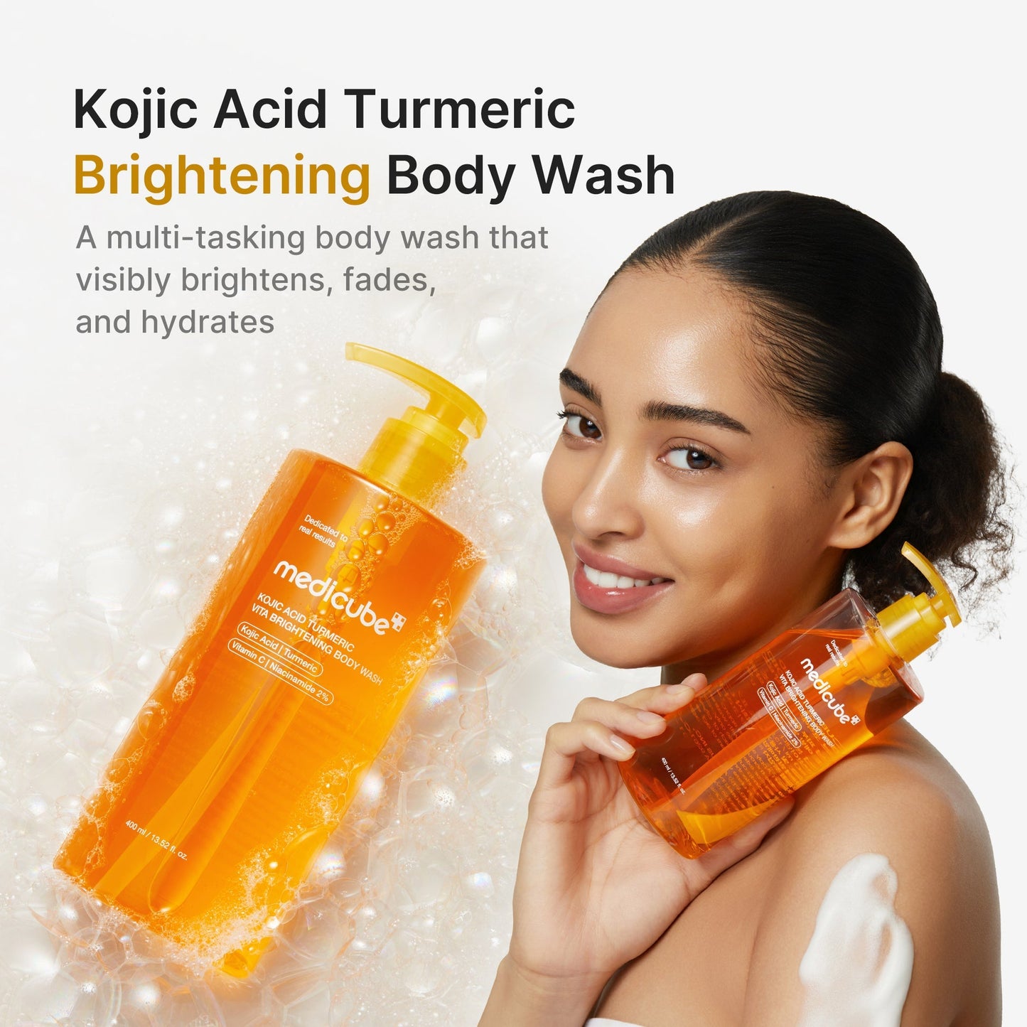 Medicube Kojic Acid Turmeric Trilogy Glow Set with skincare products featuring white and orange packaging, placed on a white surface.