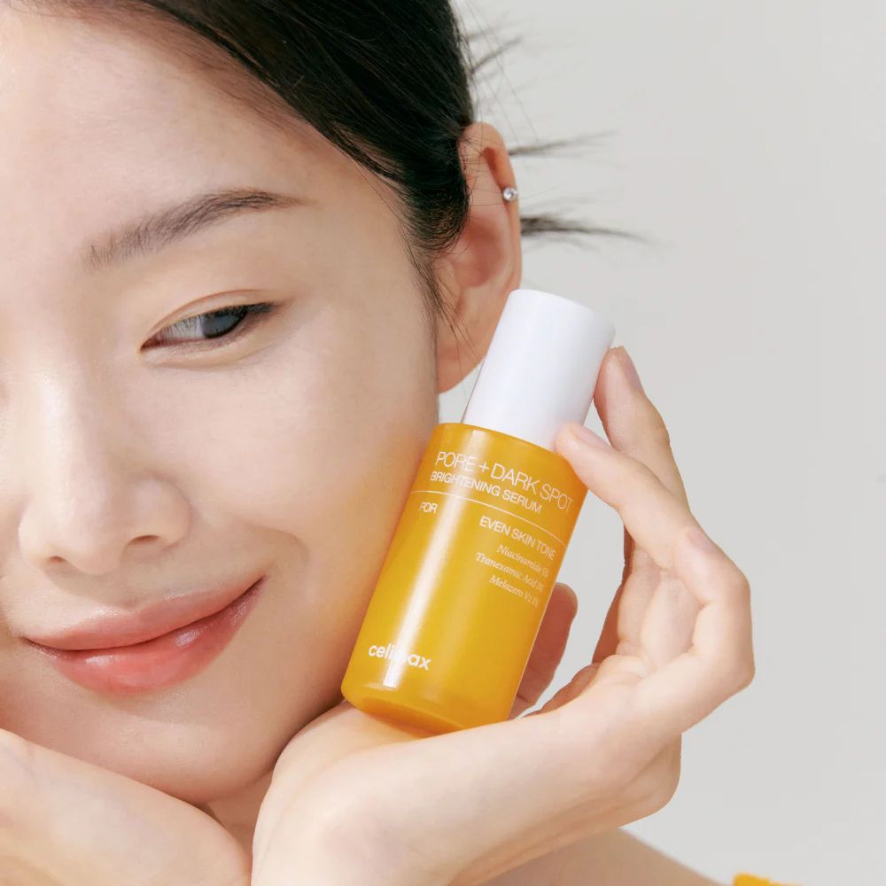 Celimax Pore Dark Spot Brightening Serum in a sleek bottle, showcasing its packaging with a focus on brightening and pore care.
