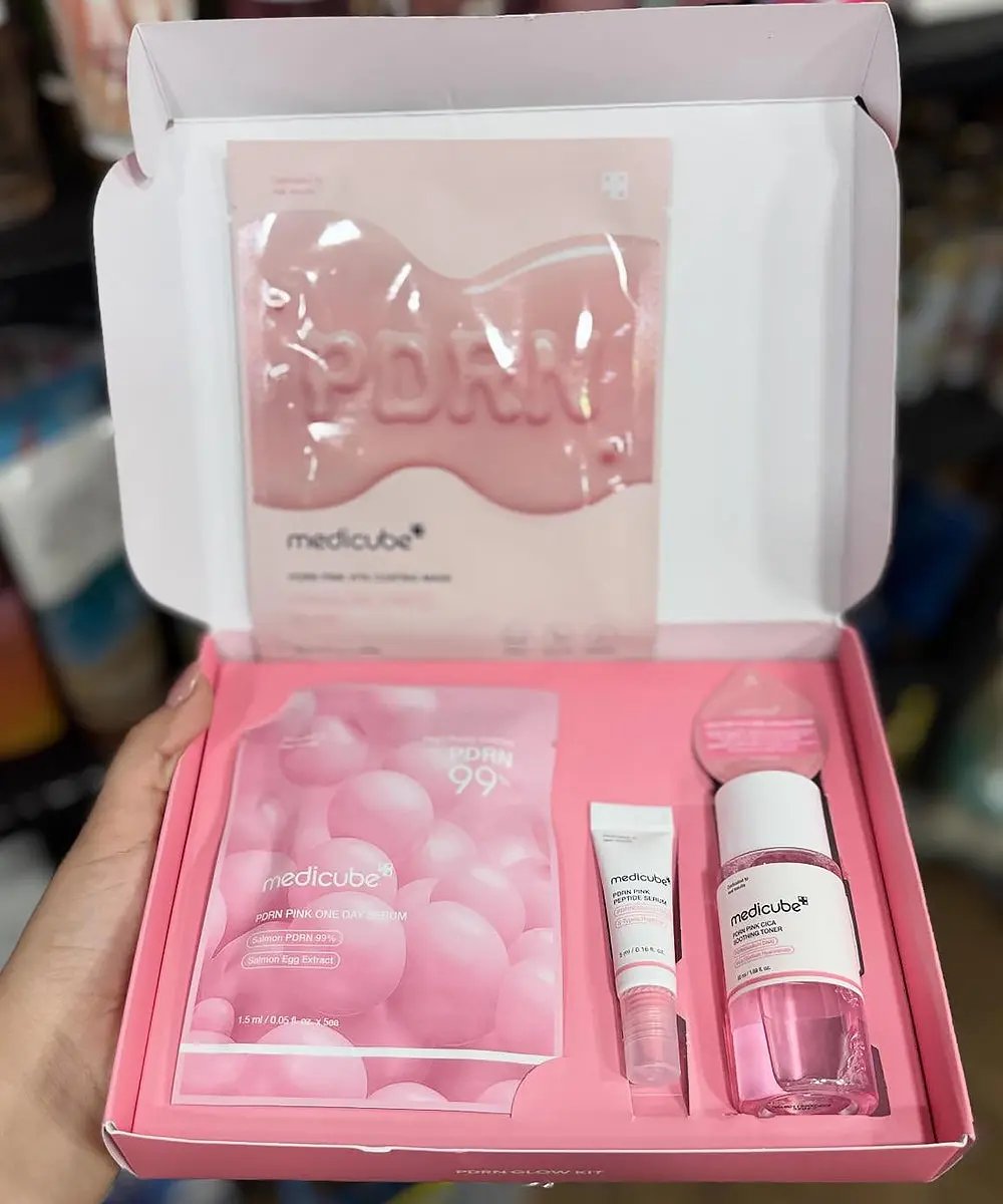 Medicube PDRN Glow Kit for skin care featuring bottles of serum and cream with brightening and rejuvenating ingredients.
