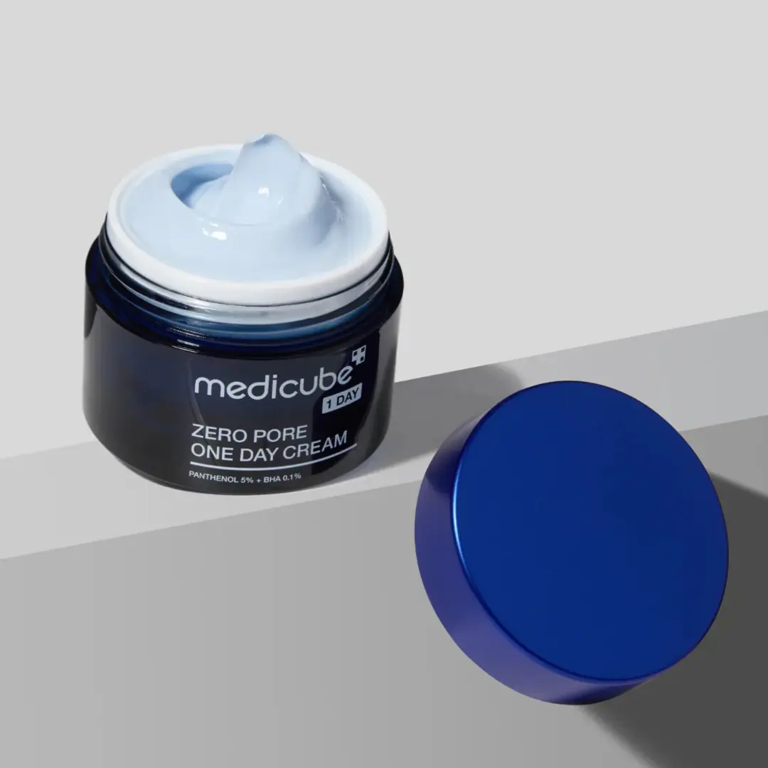 Medicube Zero Pore One Day Cream 50ml jar showing the cream's smooth texture in a sleek container.