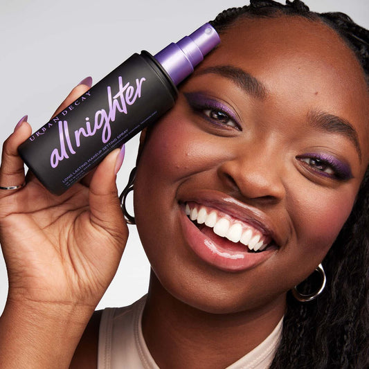 Urban Decay All Nighter long-lasting makeup setting spray bottle on a neutral background