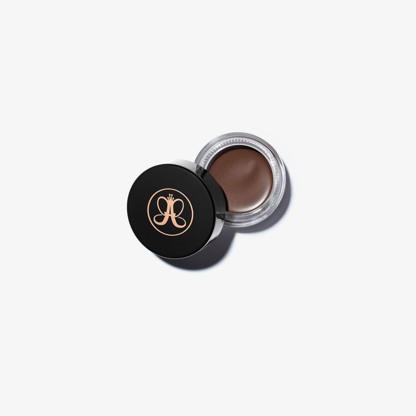 Anastasia Beverly Hills DIPBROW® Pomade in Auburn, brow makeup product with a small jar and brush for defining eyebrows.