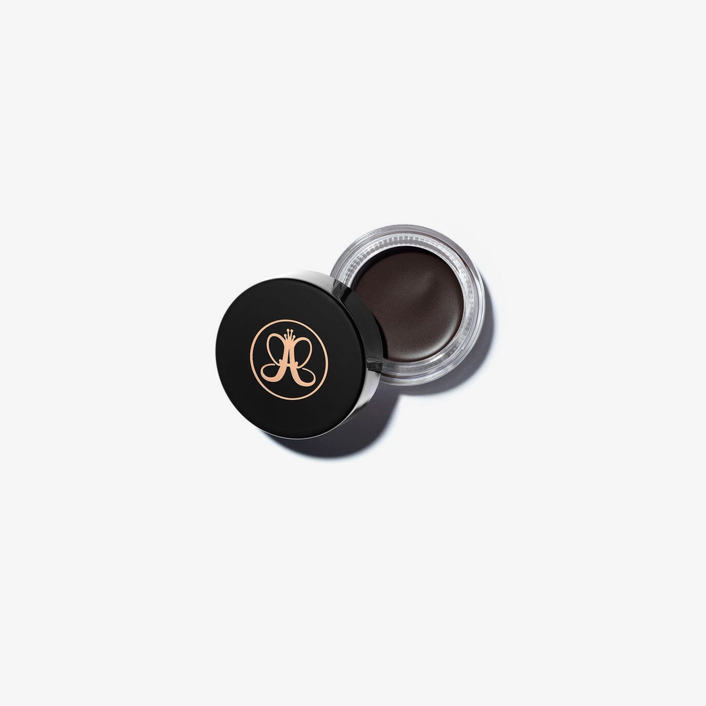 Anastasia Beverly Hills DIPBROW® Pomade in Ebony, a brow styling product with a sleek container and deep black shade.