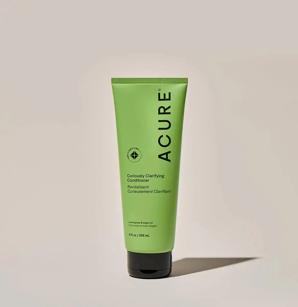 ACURE Curiously Clarifying Shampoo and Conditioner set, natural hair care bundle with cleansing formulas, in matching bottles.