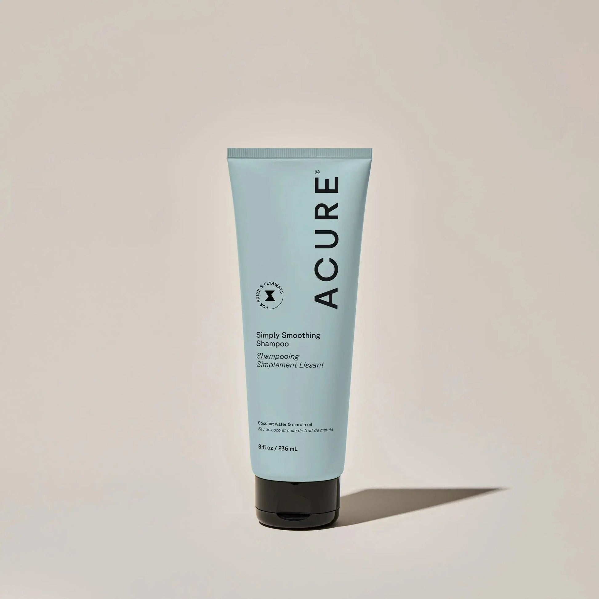 ACURE Simply Smoothing Shampoo and Conditioner bundle, featuring bottles of hair care products with clean labels and pump dispensers.