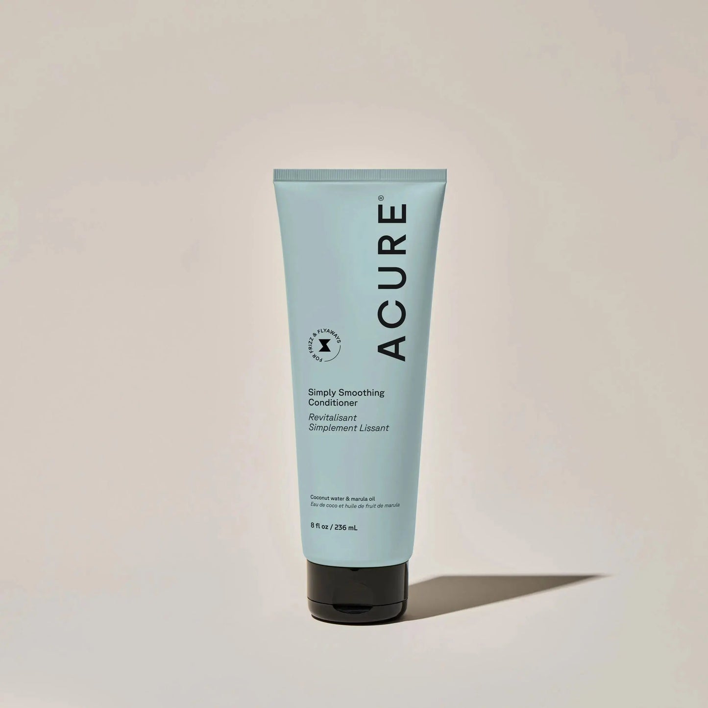 ACURE Simply Smoothing shampoo and conditioner bundle featuring bottles with white and green packaging for smooth, manageable hair.