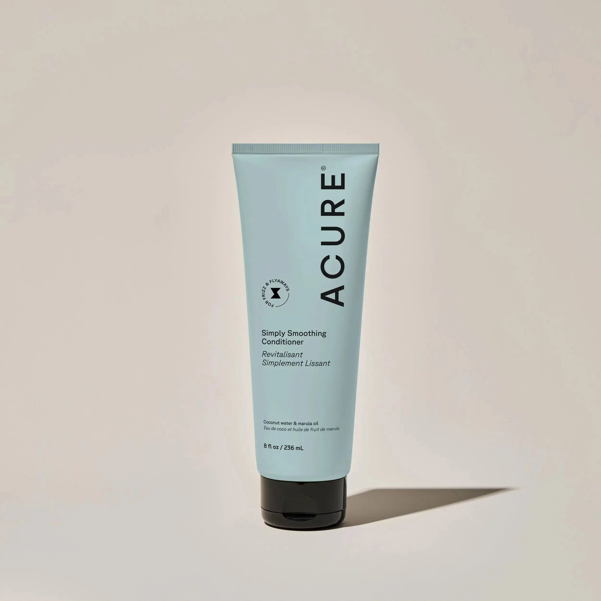 ACURE Simply Smoothing shampoo and conditioner bundle featuring bottles with white and green packaging for smooth, manageable hair.