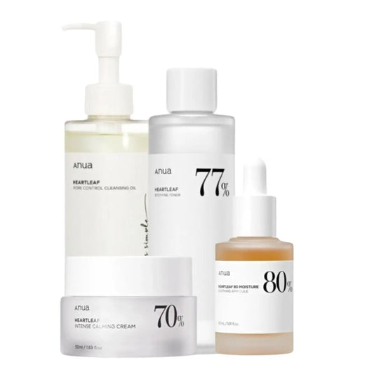 Anua skincare set featuring cleansing oil, toner, serum, and cream displayed together in a coordinated collection.