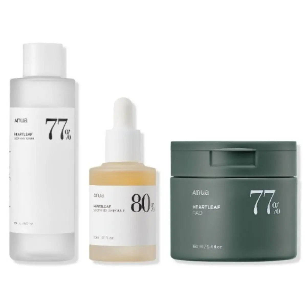 Anua Heartleaf Series 3 skincare set with toner, soothing ampoule, and clear pads arranged together.