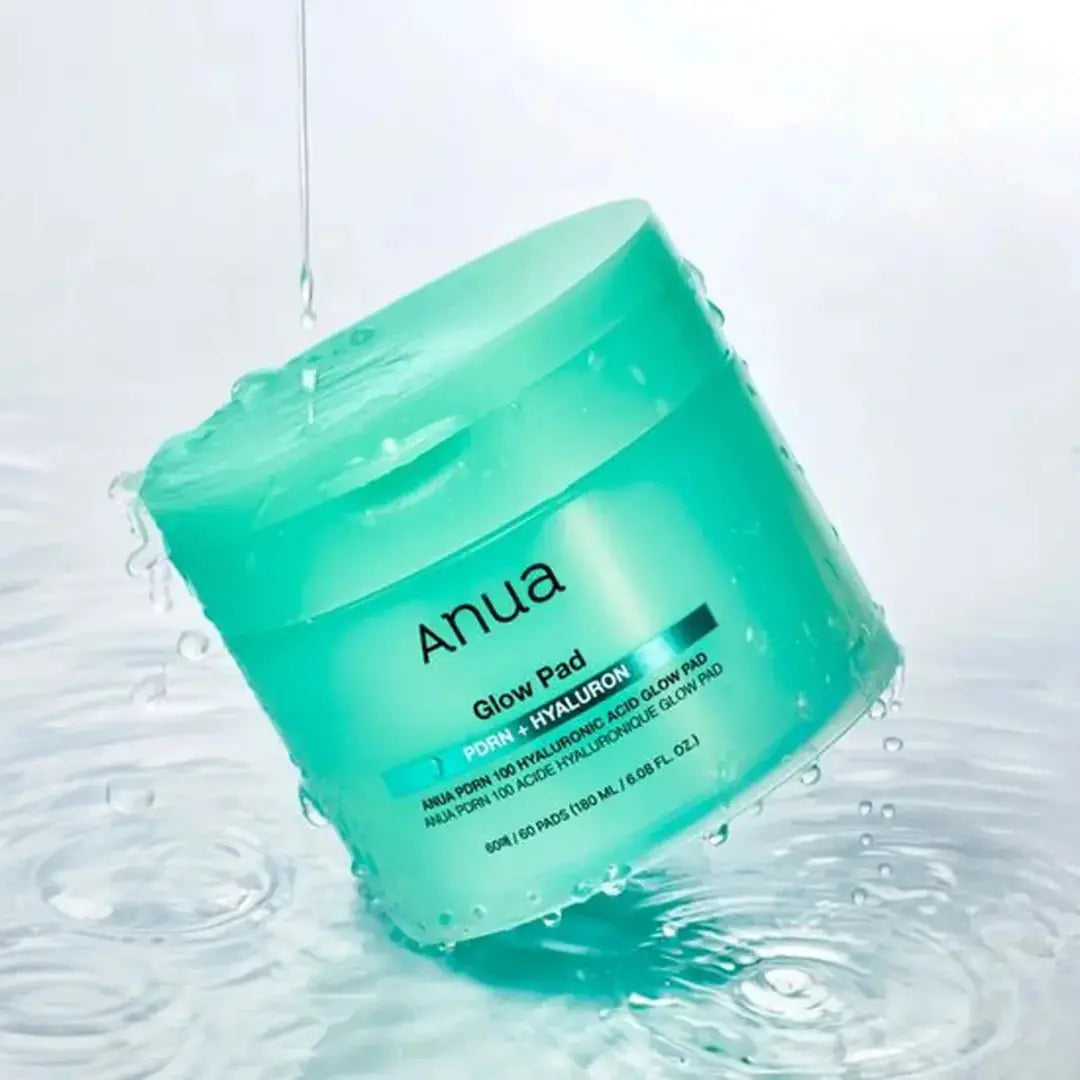 ANUA PDRN 100 Hyaluronic Acid Glow Pads, 60 soft exfoliating pads for bright, hydrated skin, shown in a white jar with pads.