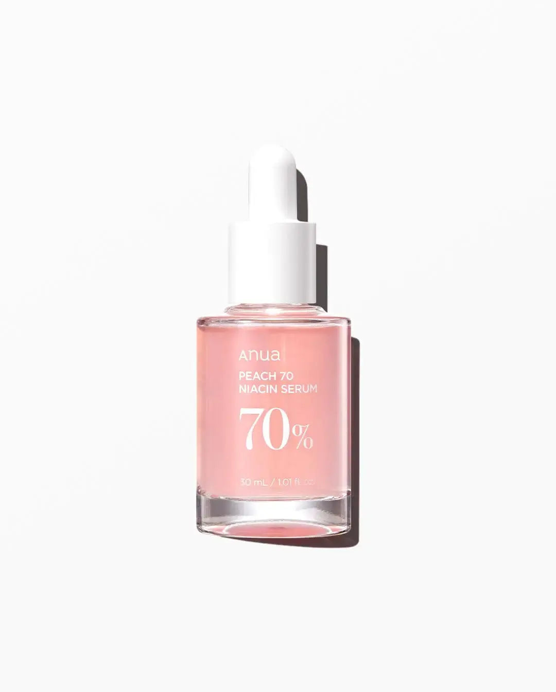 Anua Peach 70% Niacinamide Serum 30ml bottle featuring a clear dropper and peach-themed packaging for brightening and skin hydration