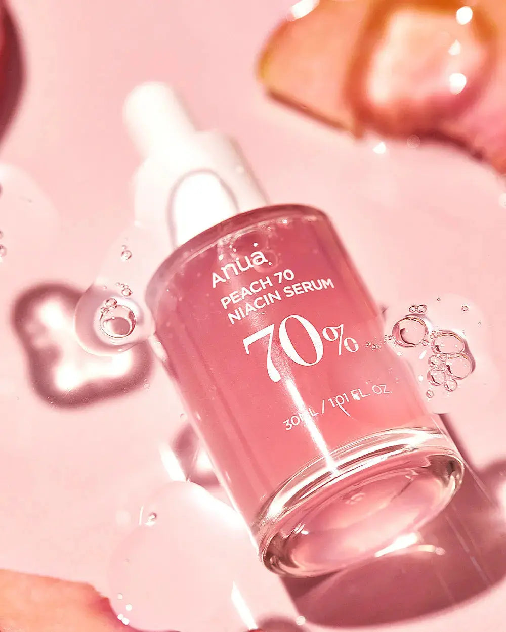 ANUA Peach 70% Niacinamide Serum 30 ml bottle with a clear pump dispenser and peach-themed packaging.