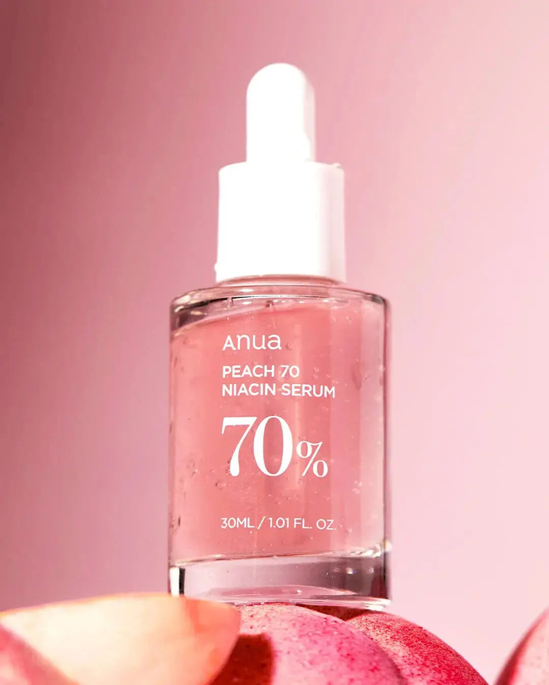 ANUA Peach 70% Niacinamide Serum 30 ml bottle with a sleek design, showcasing the skincare product in a clear container.