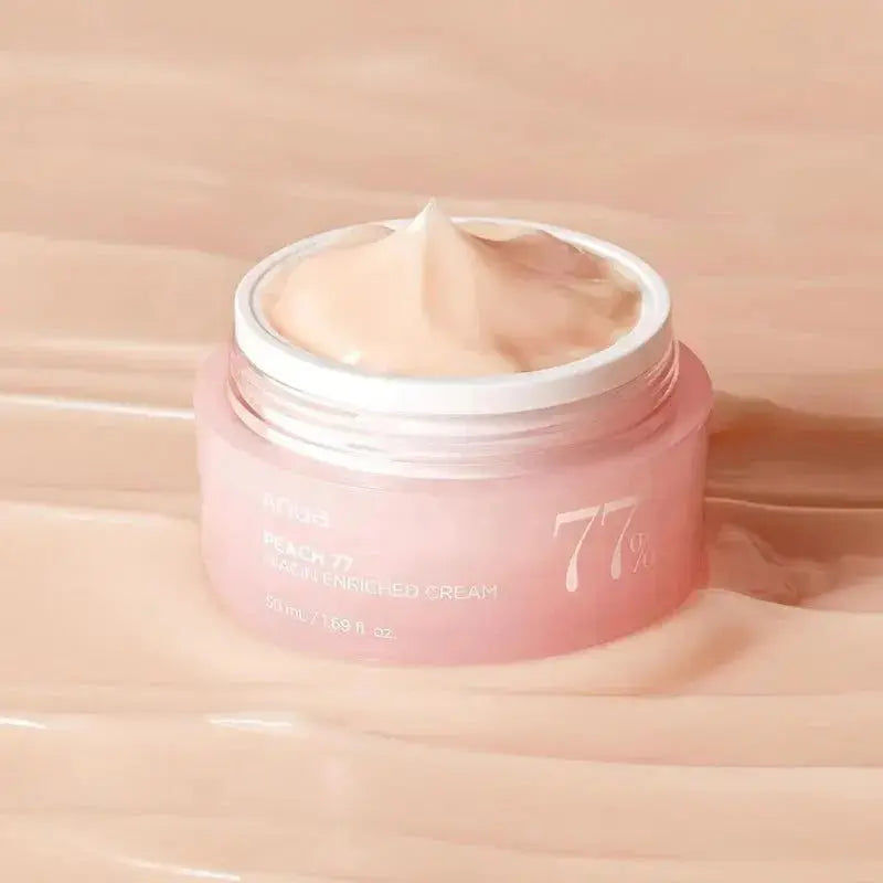 ANUA Peach 77% Niacin Enriched Cream in a 50 ml jar, featuring a peach-colored container and creamy texture.
