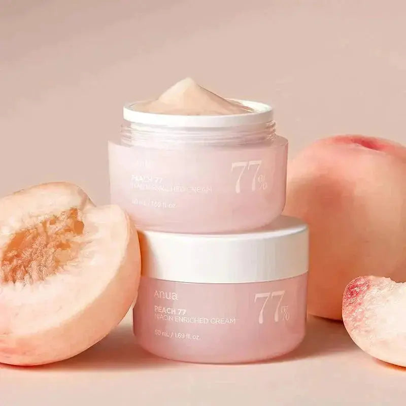 ANUA Peach 77% Niacin Enriched Cream 50ml jar showing the peach-colored cream in a white container with a clear lid.