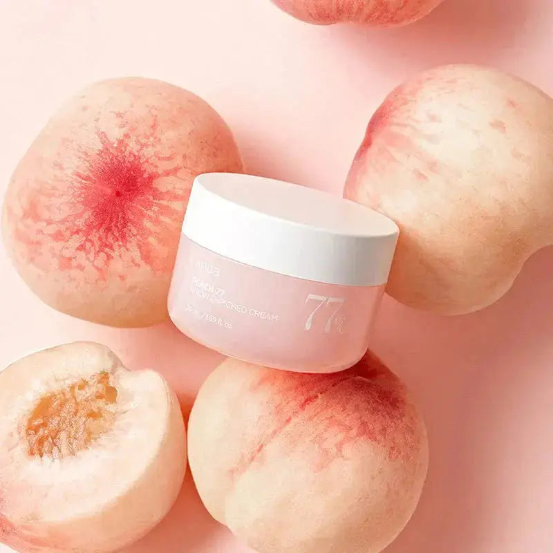 ANUA Peach 77% Niacin Enriched Cream 50ml jar showing peach-colored cream with peach and niacin ingredients in the background