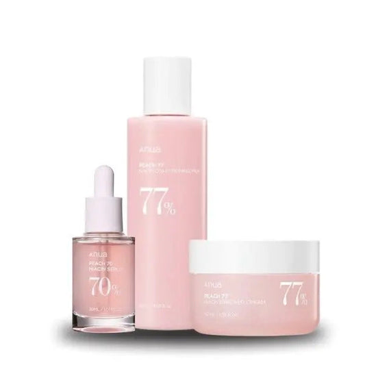 Anua Peach 77 Series skincare set with peach-themed bottles and jars, featuring cleansers, toners, and moisturizers.