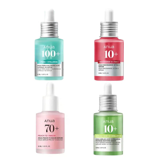 Set of ANUA serums including various skincare bottles and dropper applicators in a clear display arrangement.