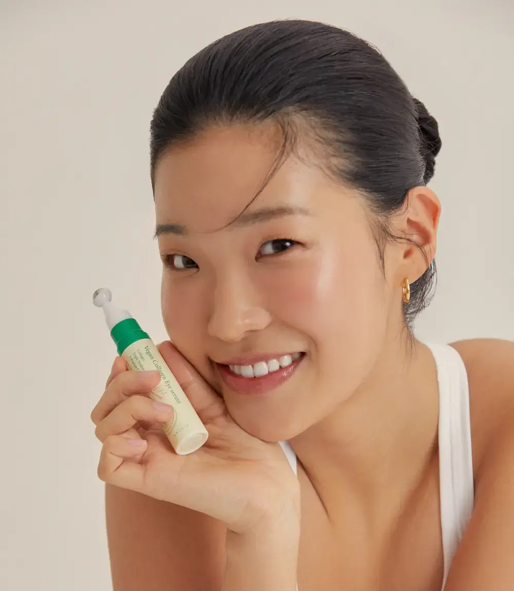AXIS-Y Vegan Collagen Eye Serum in 10 ml bottle with clear applicator tip, designed to hydrate and brighten the delicate eye area.