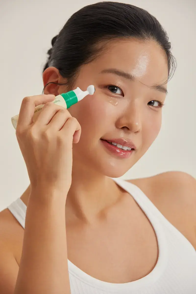 AXIS-Y Vegan Collagen Eye Serum in 10 ml bottle, featuring a sleek design and applicator for nourishing eye area care.
