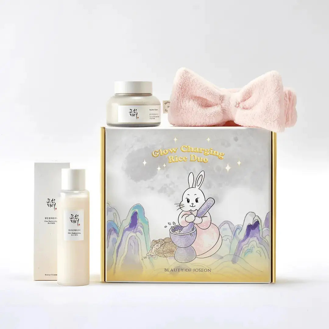 Beauty of Joseon Glow Charging Rice Duo Kit with skincare products in white and gold packaging on a clean surface.