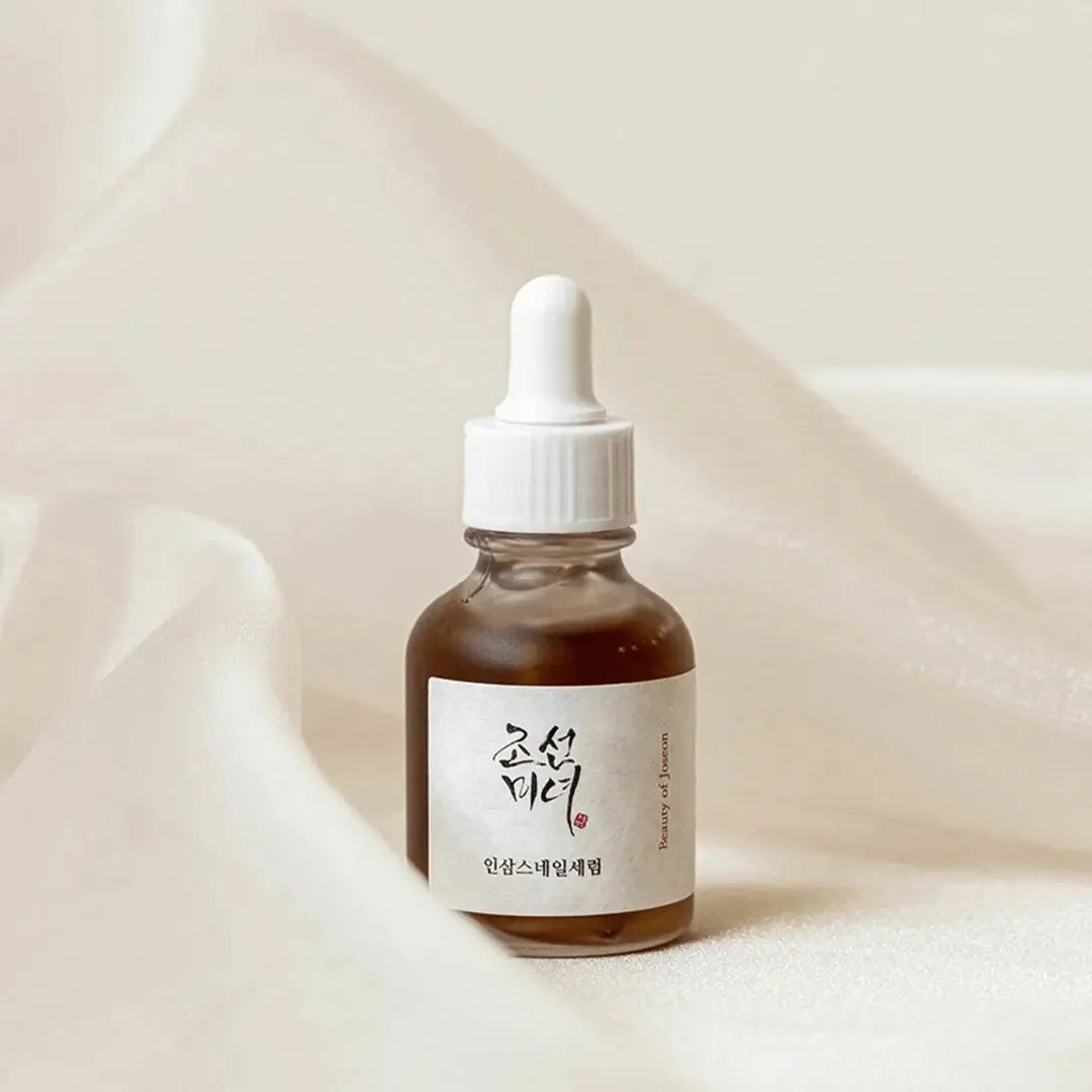 Beauty of Joseon Revive Serum with ginseng and snail mucin in a 30 ml bottle, showcasing the serum's sleek packaging.