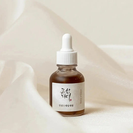 Beauty of Joseon Revive Serum with ginseng and snail mucin in a 30 ml bottle, showcasing the serum's sleek packaging.