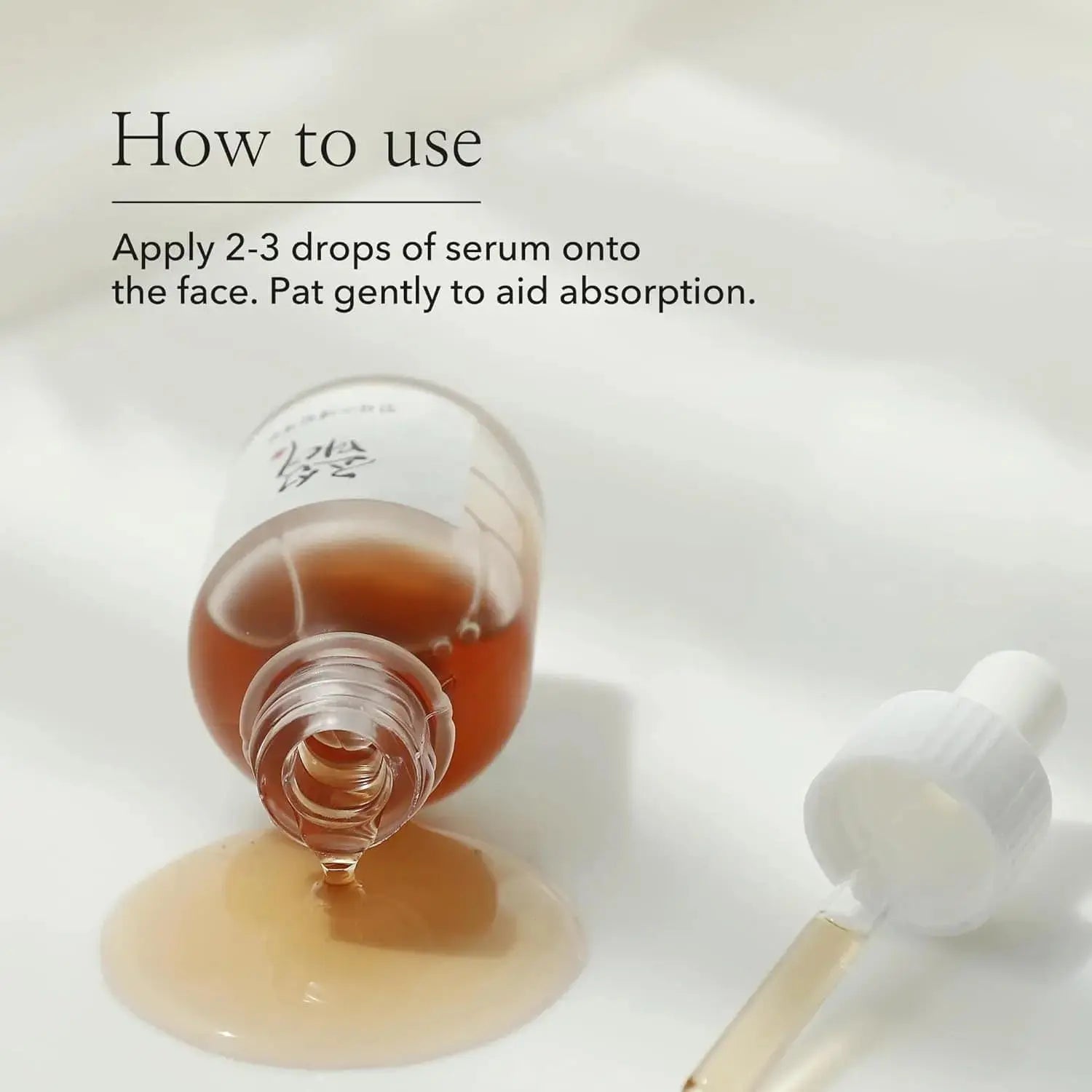 Beauty of Joseon Revive Serum with ginseng and snail mucin in 30 ml bottle, featuring a clear dropper and elegant packaging