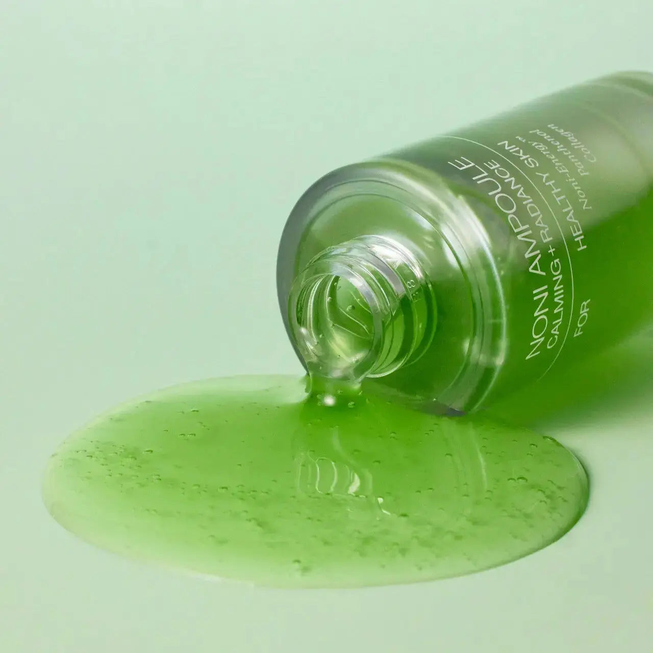 CELIMAX The Real Noni Energy Ampoule 30ml bottle with clear packaging and vibrant label, showcasing a skincare ampoule product.