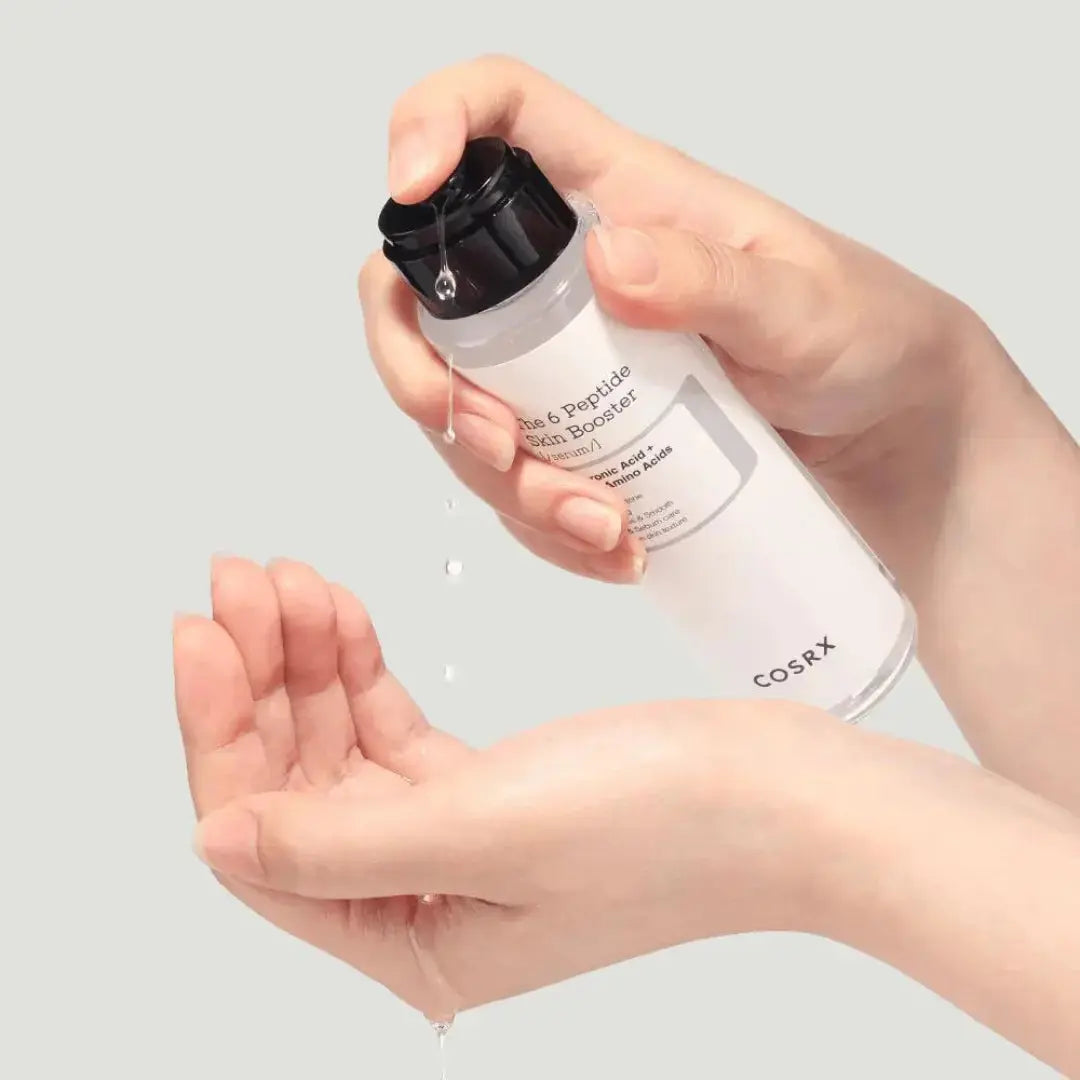 COSRX The 6 Peptide Skin Booster in a 150ml bottle, featuring a clear liquid with a pump dispenser and label on the front.
