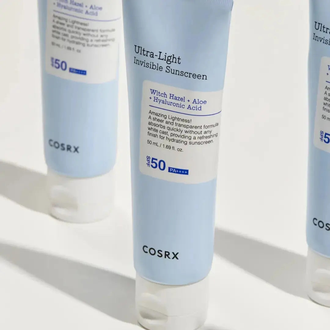 COSRX Ultra Light Invisible Sunscreen 50ml tube with a minimalist design, showing the lightweight, transparent formula of the sunscreen.