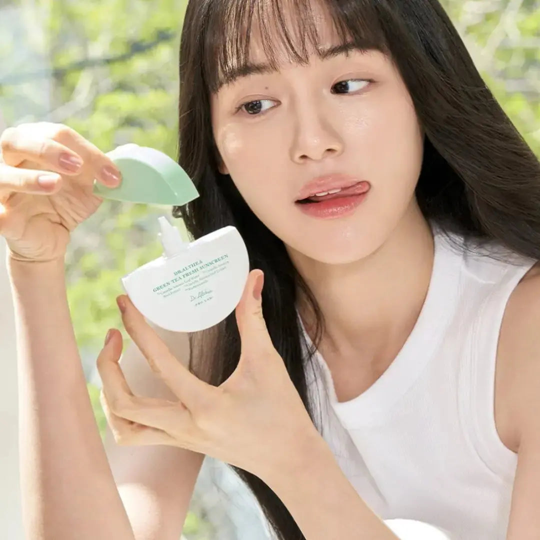 DR ALTHEA Green Tea Fresh Sunscreen 45 ml bottle, featuring a green tea extract label and white pump dispenser.