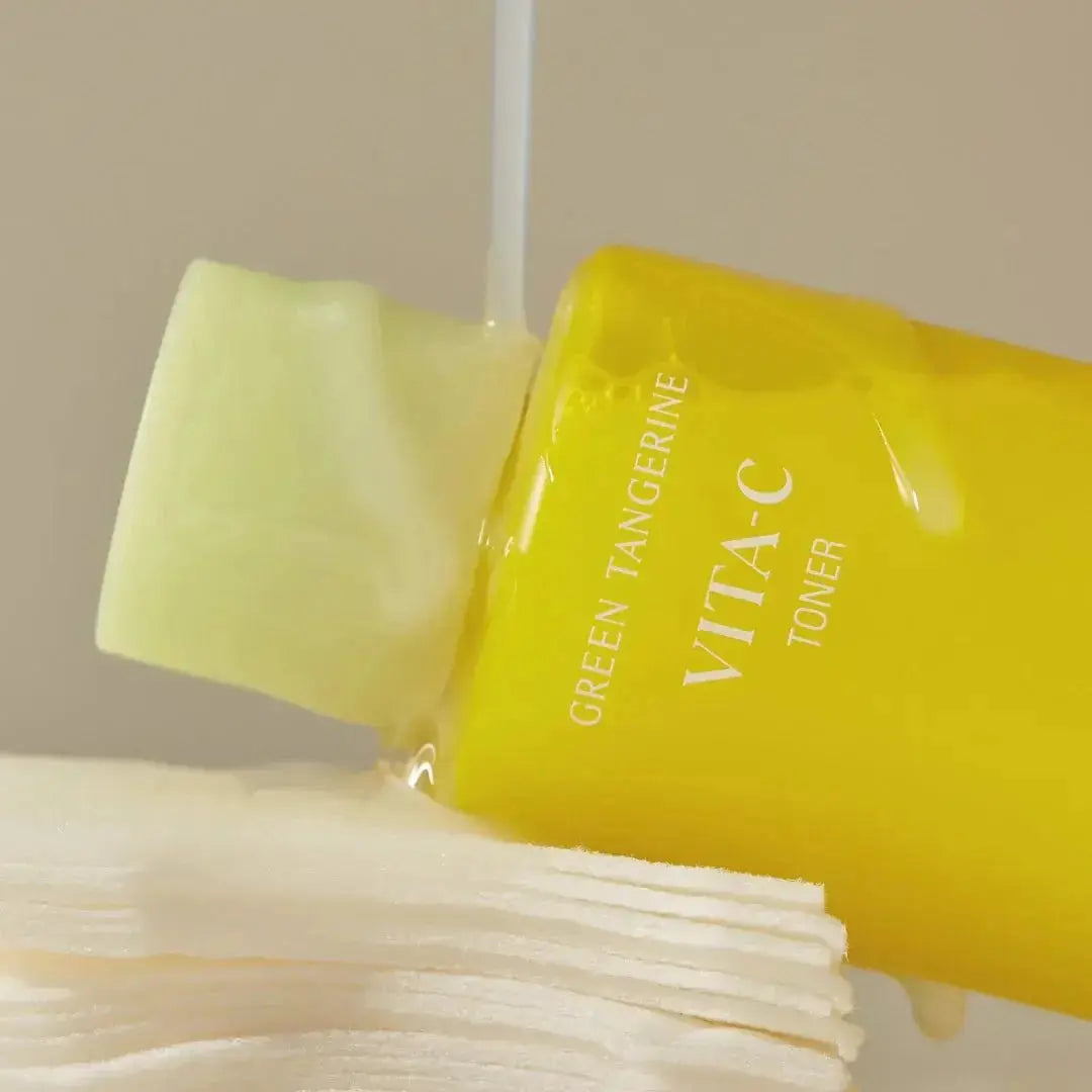 Goodal Green Tangerine Vita C Toner in a 100ml bottle, bright orange liquid with citrus slices, skincare product for brightening.