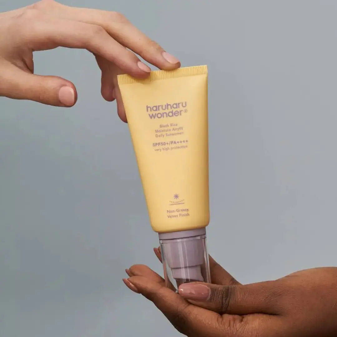 Haruharu Wonder Black Rice Moisture Airyfit Sunscreen 50ml bottle with white cap and black packaging, designed for sun protection.