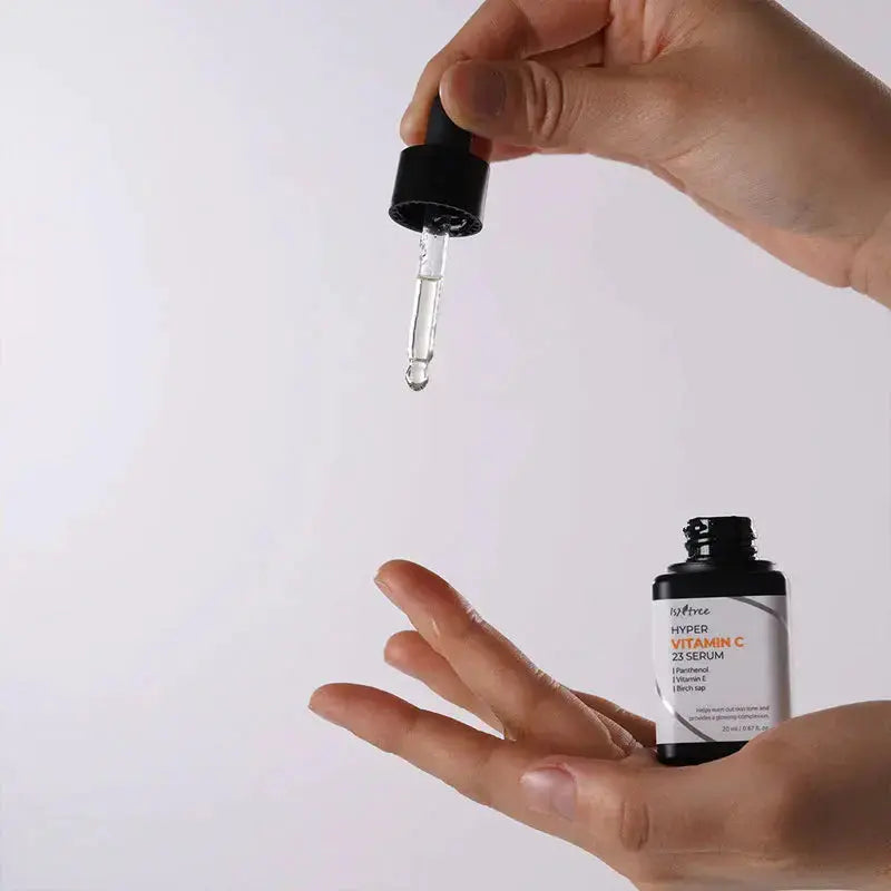 ISNTREE Hyper Vitamin C 23 Serum in 20ml bottle, featuring bright orange packaging and dropper for skincare application