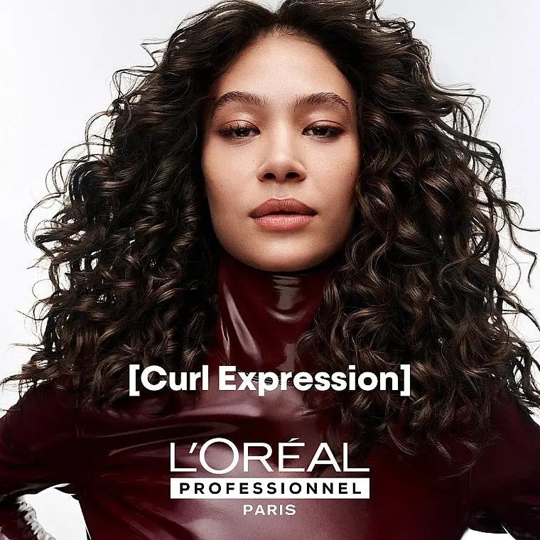 L'OREAL PROFESSIONNEL Curl Expression Moisturizing Cleansing Cream Shampoo bottle with label and product details.