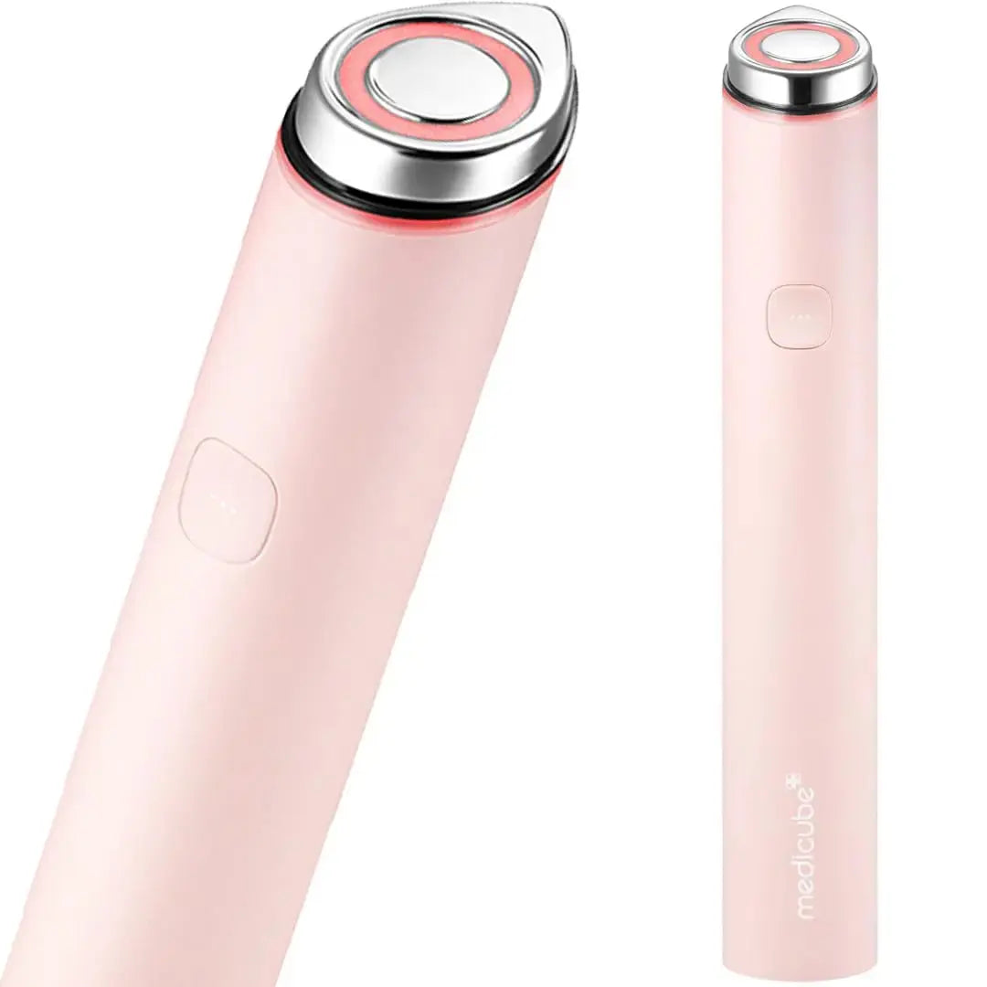 Medicube AGE R Booster Pro Mini in pink, showing a compact skincare bottle with product label visible.