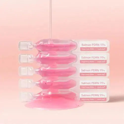 Set of 10 Medicube PDRN Pink One Day Serums, 1.5ml each, displayed in a clear container showing the small serum bottles.