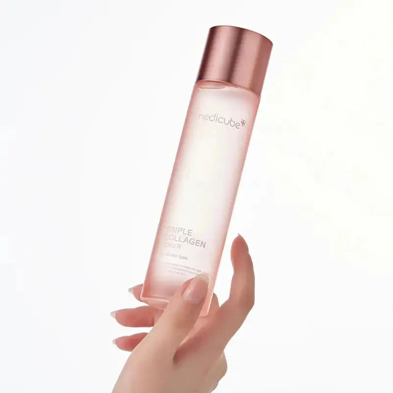 Medicube Triple Collagen Toner in a 140 ml bottle, showing the clear liquid and minimalist label design.