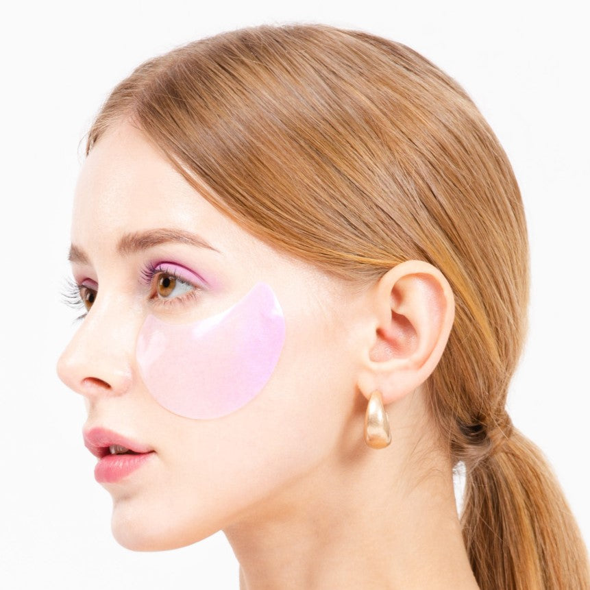 K-SECRET Advanced Regenerating Eye Gel Patches with Retinol, close-up of eye patches on model's skin showing rejuvenating effects