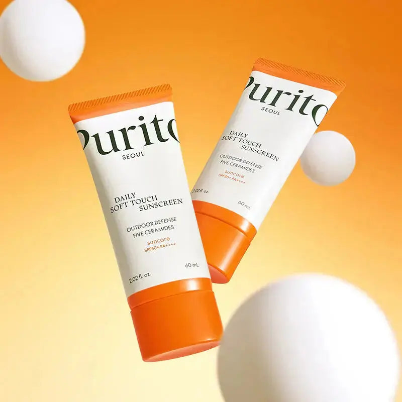 PURITO Daily Soft Touch Sunscreen 60ml bottle with SPF protection, featuring a sleek design and lightweight formula.