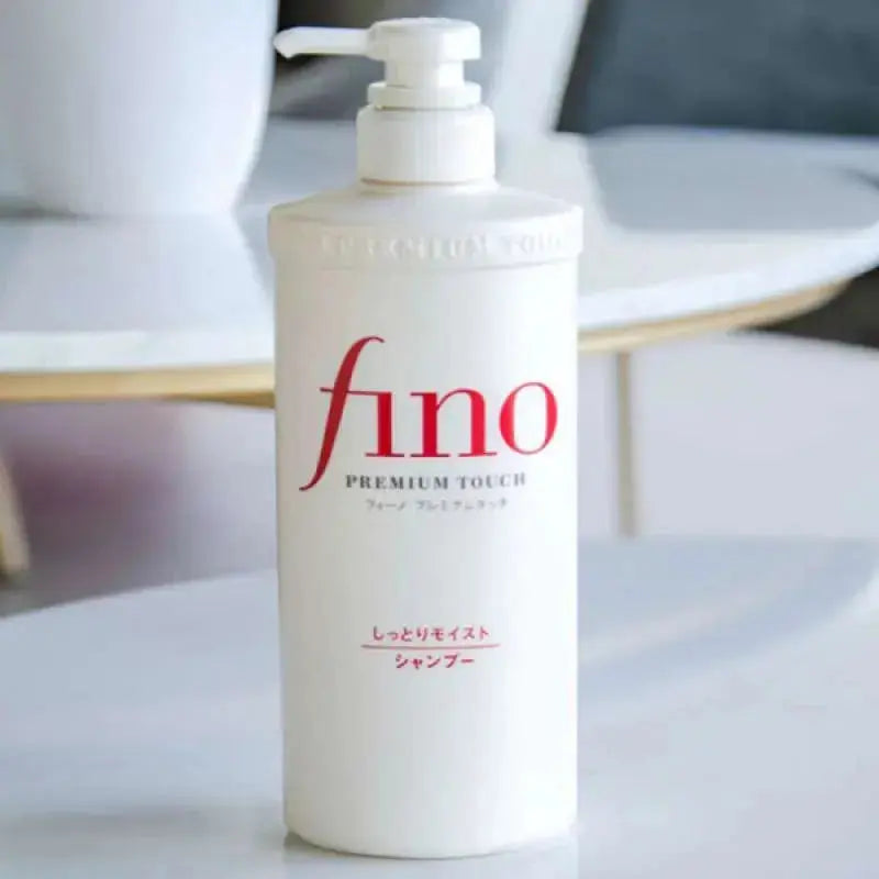 Shiseido Fino Premium Touch Moist Shampoo and Conditioner bottles, 550 ml, with sleek packaging and product labels visible.