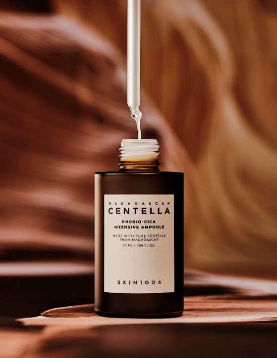 SKIN 1004 Madagascar Centella Probio-Cica Intensive Ampoule serum in a glass bottle with a dropper, designed for soothing skin.