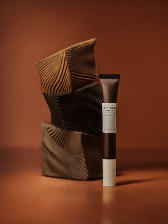 SKIN 1004 Madagascar Centella Probio-Cica Bakuchiol Eye Cream in a jar, showcasing the cream's smooth texture and branding on the packaging.